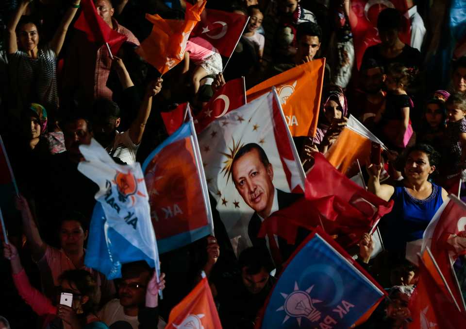 Supporters of Turkish President and the leader of the Justice and Development Party (AK Party) Recep Tayyip Erdogan celebrate as unofficial results show Erdogan leading the presidential election in main opposition CHP's stronghold city Izmir on June 24, 2018.