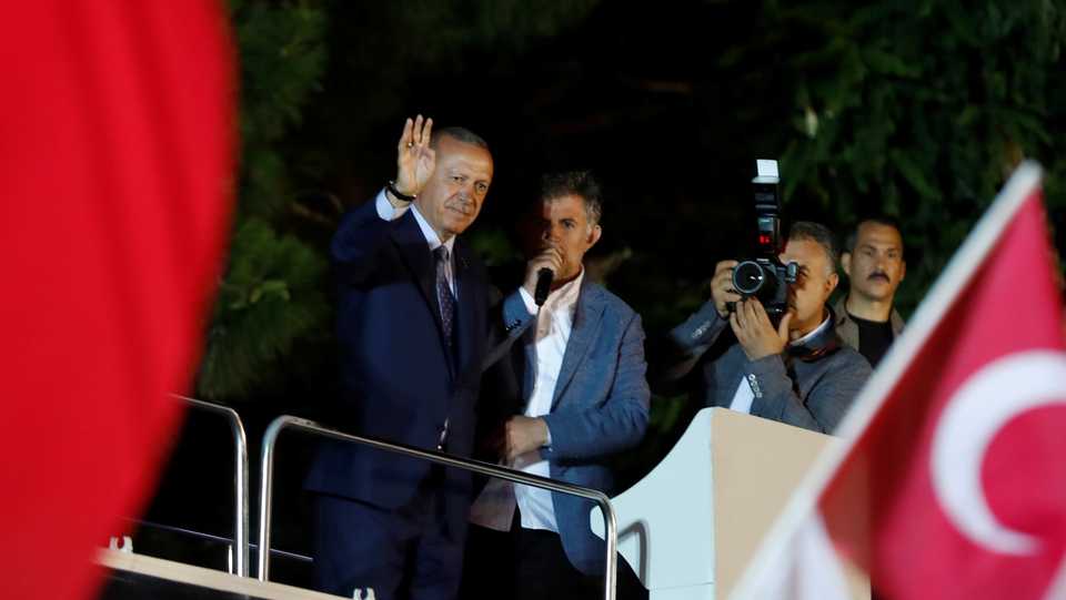 Turkish President Recep Tayyip Erdogan waves to his supporters in Istanbul, Turkey. June 24, 2018.