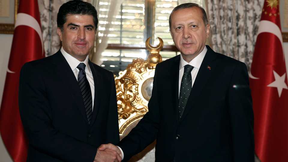 Turkey's President Recep Tayyip Erdogan (R) and KRG Prime Minister Nechirvan Barzani shake hands before a meeting in Istanbul on November 23, 2016.