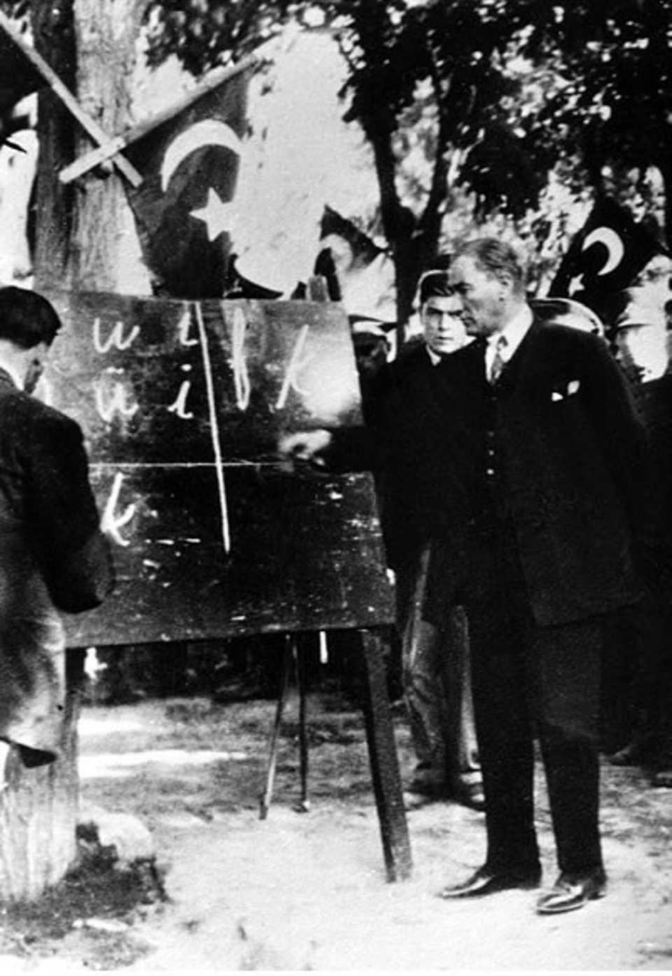 In November 1928, soon after the Republic was declared, Mustafa Kemal changed written Turkish, using Roman letters instead of the previous Ottoman Arabic script. He introduced the new Latin alphabet overnight. Picture: Mustafa Kemal teaching the new alphabet to the people of Kayseri. September 20, 1928.