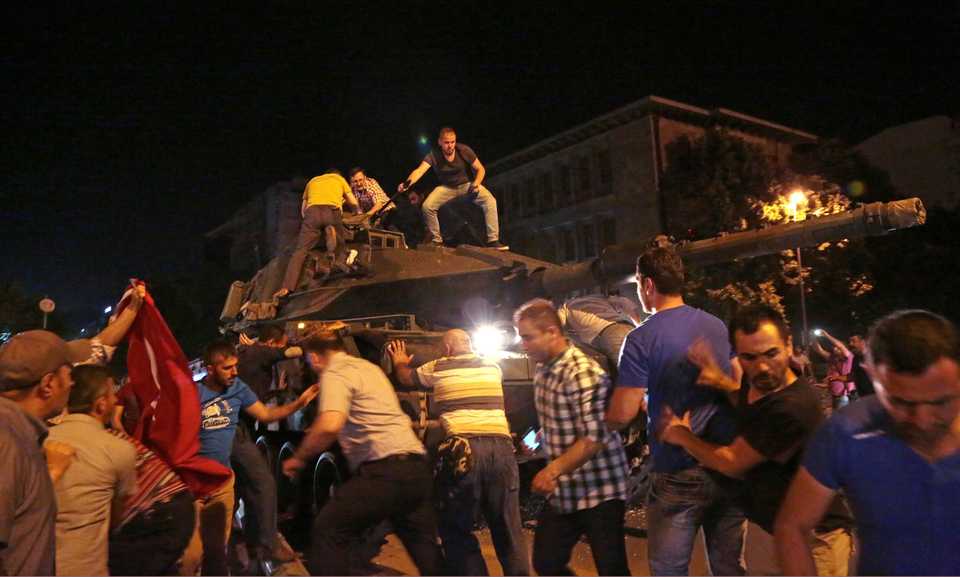 In this July 15, 2016 file photo, tanks move into position as Turkish people attempt to stop them, in Ankara, Turkey.