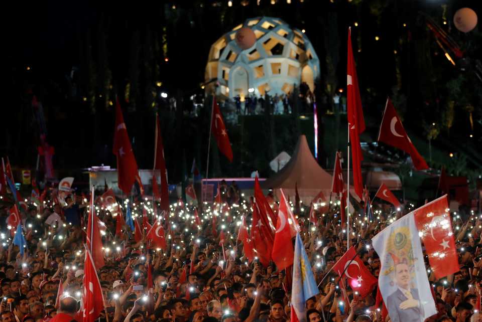 People attend a ceremony marking the second anniversary of the attempted coup at the July 15 Martyrs' Bridge in Istanbul, Turkey, July 15, 2018.