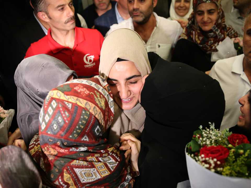 Turkish citizen Ebru Ozkan is welcomed by her relatives in Turkey.