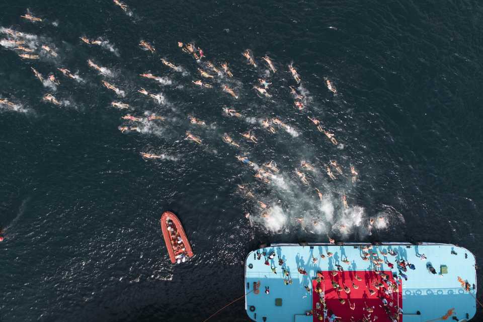 Aerial photo shows swimmers compete during the 30th Samsung Cross-continental Swimming Race organised by the Turkish Olympic Committee in Istanbul, Turkey on July 22, 2018.
