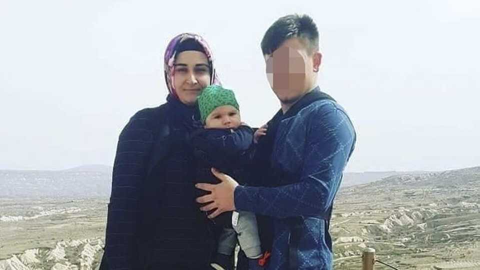 Eleven-month old Bedirhan Mustafa together with his mother and father in an undated family photo.