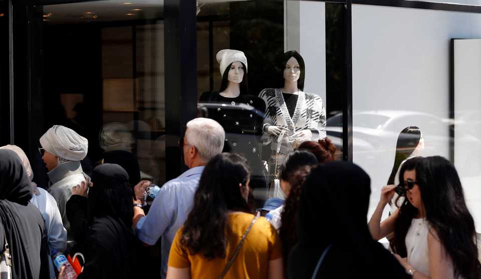 Tourists rushed to luxury goods stores after the lira's depreciation made the goods cheaper in foreign currency.