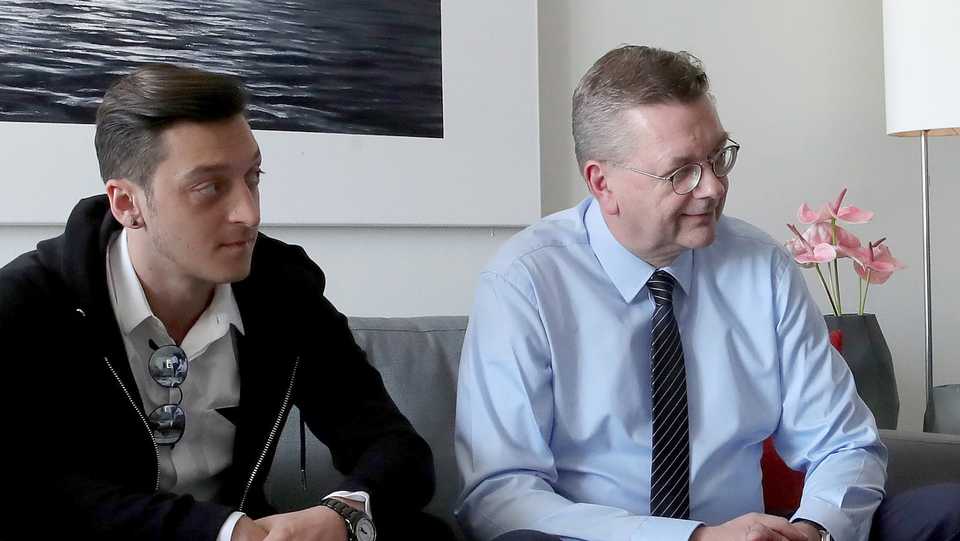 DFB president Reinhard Grindel meets former German national player Mesut Ozil prior to the DFB Cup Final 2018 between Bayern Muenchen and Eintracht Frankfurt on May 19, 2018 in Berlin, Germany.