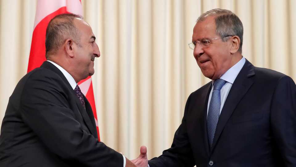 Russia's Foreign Minister Sergey Lavrov shakes hands with his Turkish counterpart Mevlut Cavusoglu after a news conference in Moscow, Russia August 24, 2018.
