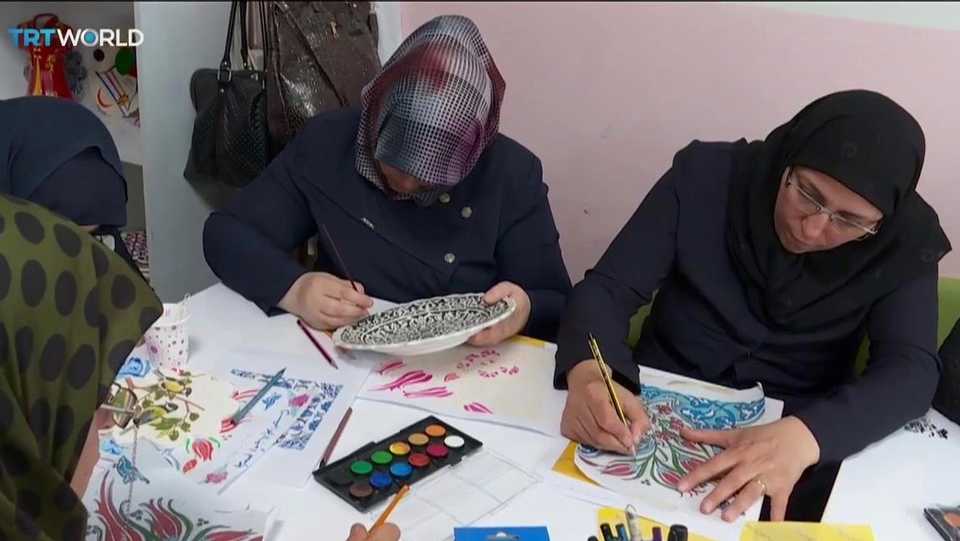 Syrian refugee women study the art of painting ceramic tiles, at the SADA Women Empowerment and Solidarity Centre in Gazientep, Turkey.