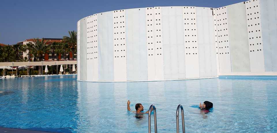 Guests enjoy the pool at Selge Beach Resort and Spa Hotel, in Manavgat near Antalya, Turkey, April 18, 2018.