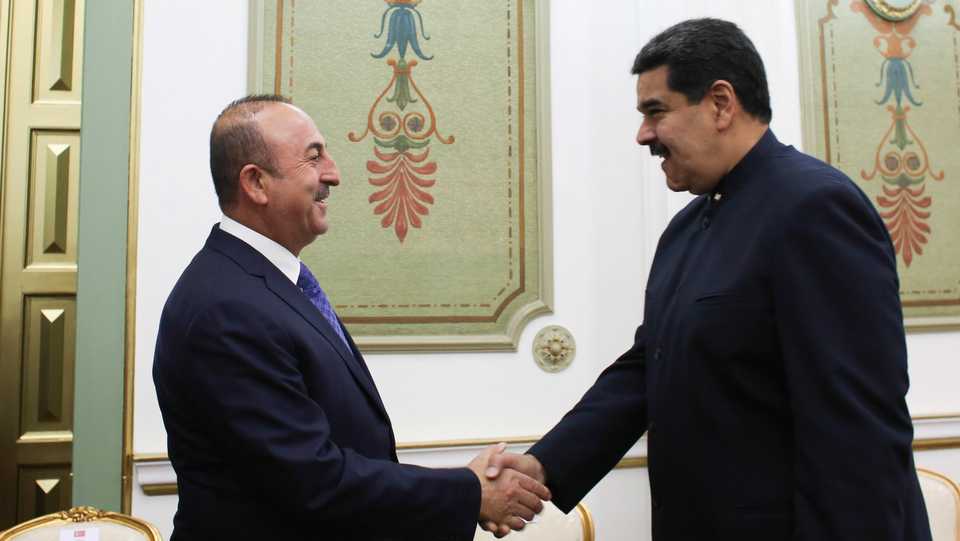 Venezuela's President Nicolas Maduro greets Turkey's Foreign Minister Mevlut Cavusoglu during their meeting in Caracas, Venezuela. (September 21, 2018)