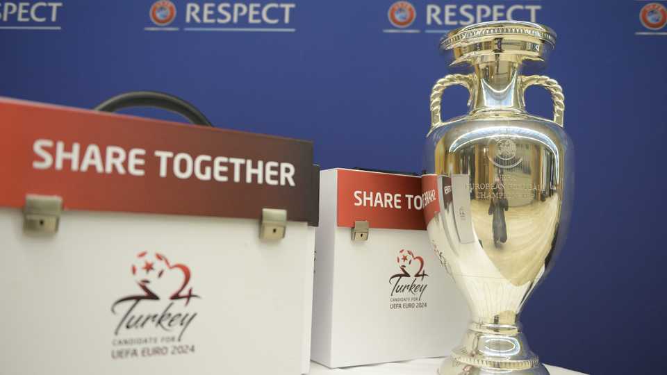 The trophy of the UEFA EURO 2024 and the tournament's Turkish logo are shown at the House of European Football on April 26, 2018 in Nyon, Switzerland.