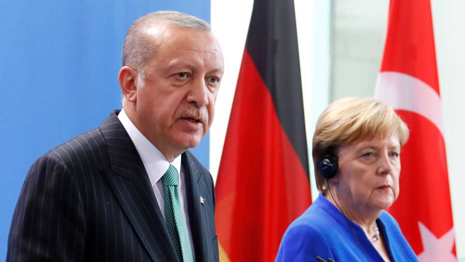 Turkish President Recep Tayyip Erdogan and German Chancellor Angela Merkel address a news conference at the chancellery in Berlin, Germany, September 28, 2018.