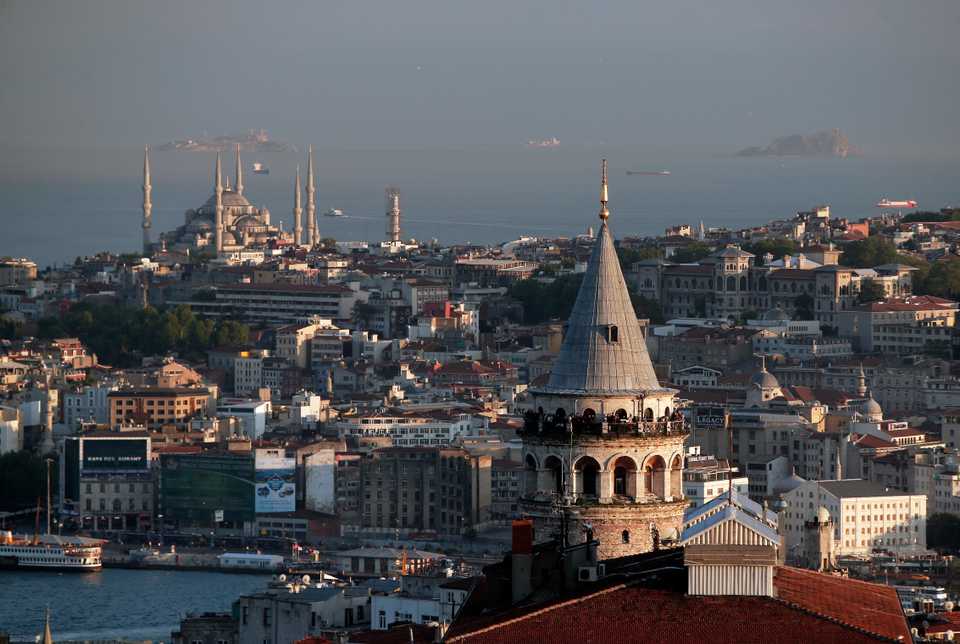 A view of Istanbul's skyline with the iconic Galata Tower (foreground right) and the Ottoman-era Sultan Ahmed Mosque (background left), better known as the Blue Mosque. May 6, 2016.