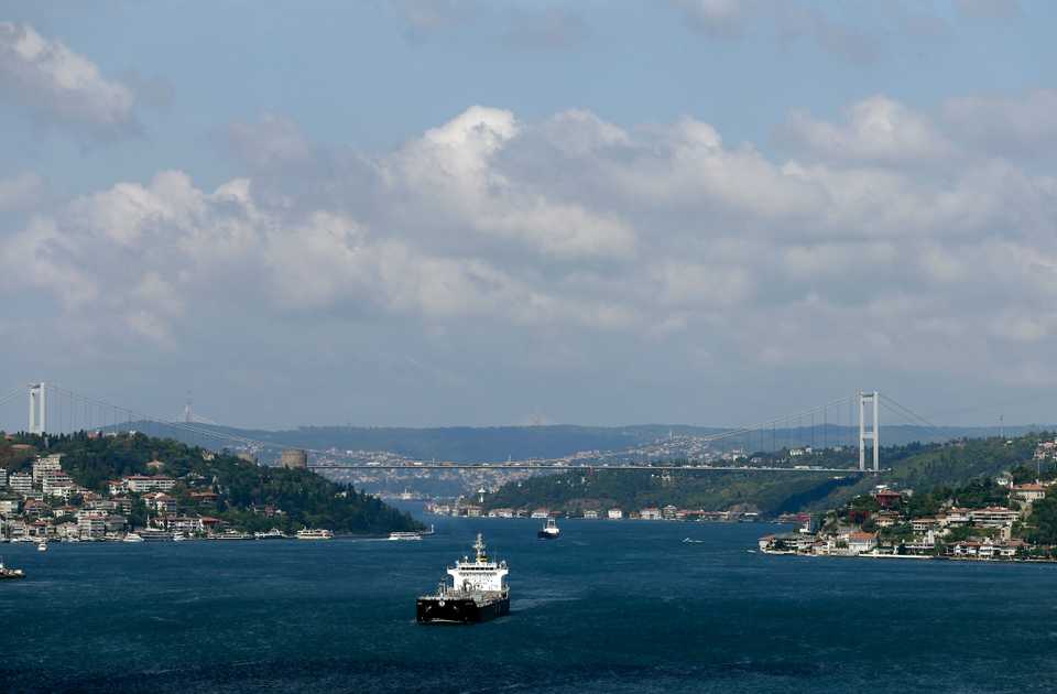 Vessels sail along the Bosphorus Strait as the Fatih Sultan Mehmet Bridge is seen in the background in Istanbul. August 19, 2016.