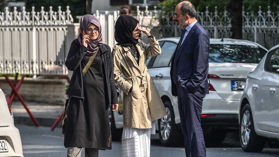 Missing journalist Jamal Khashoggi's Turkish fiancee Hatice (L) and her friends wait in front of the Saudi Arabian consulate in Istanbul, on October 3, 2018.