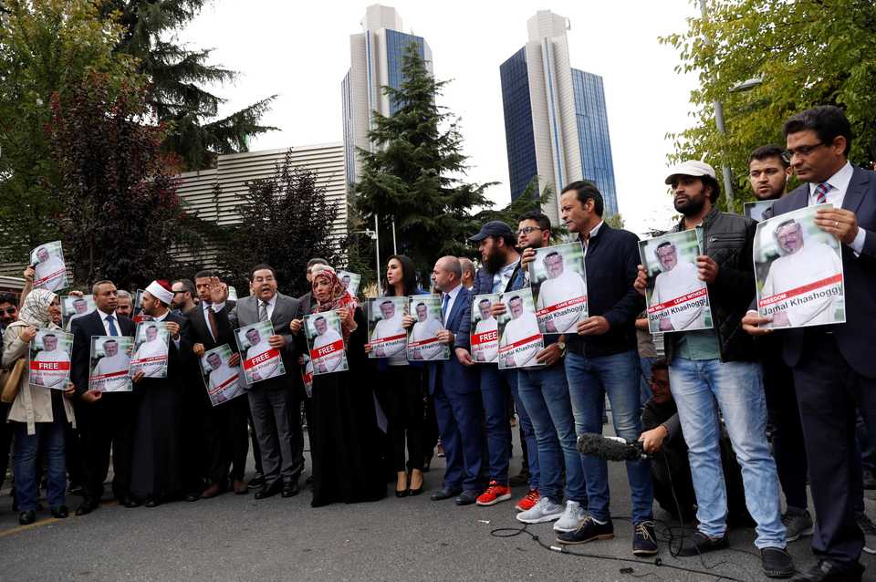 Human rights activists and friends of Saudi journalist Jamal Khashoggi protest outside the Saudi Consulate in Istanbul, Turkey, October 8, 2018.