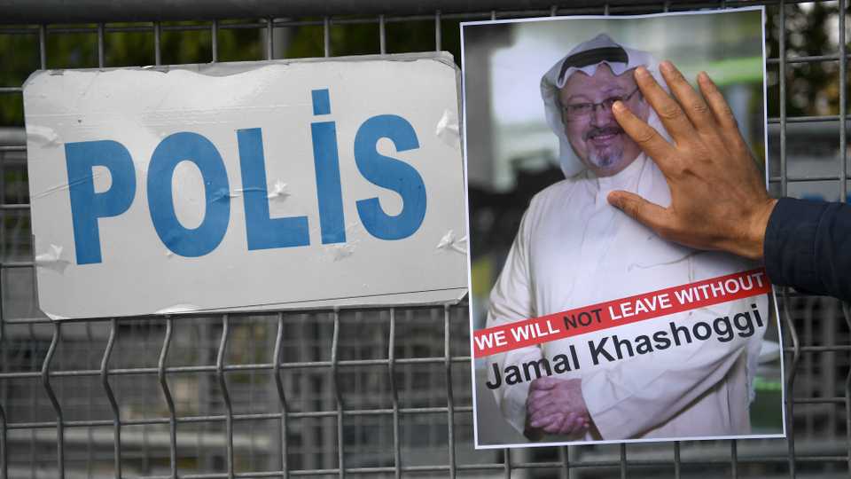 A protestor holds a picture of missing journalist Jamal Khashoggi during a demonstration in front of the Saudi Arabian consulate, on October 5, 2018 in Istanbul.