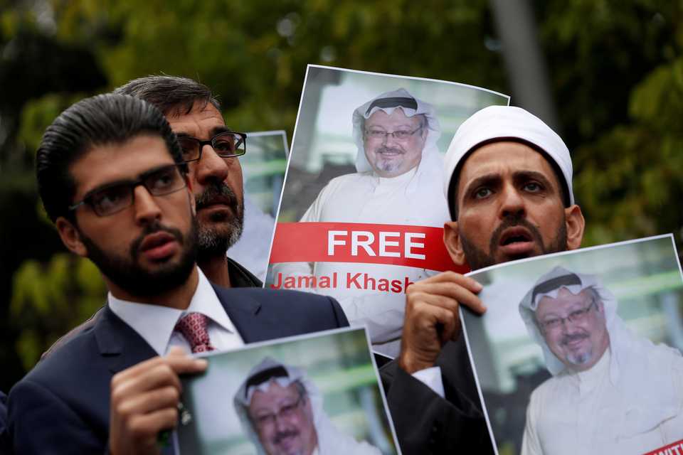 Human rights activists and friends of Saudi journalist Jamal Khashoggi hold his pictures during a protest outside the Saudi Consulate in Istanbul, Turkey on October 8, 2018.