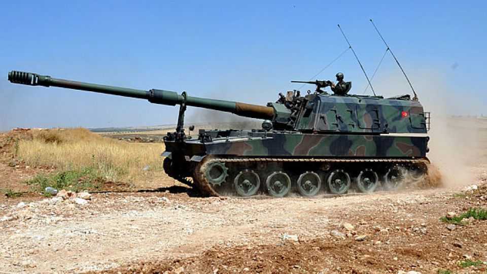 Turkish soldiers on a self-propelled howitzer at the border between Turkey and Syria's Kilis Elbeyli district. 