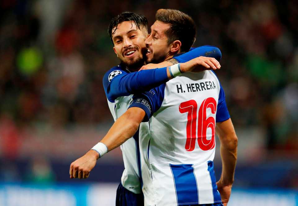 Porto's Hector Herrera celebrates scoring their second goal with Alex Telles during Lokomotiv Moscow v FC Porto at the RZD Arena, Moscow, Russia. October 24, 2018.