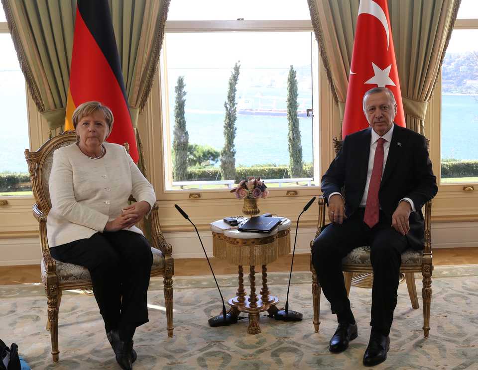 President Erdogan meets German Chancellor Angela Merkel prior to a summit on Syria.