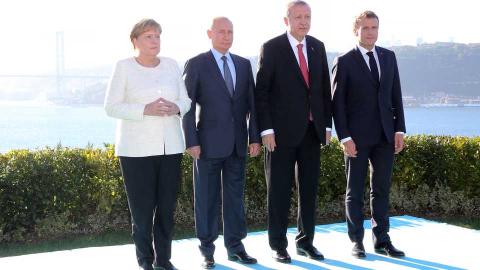 From left: Germany's Angela Merkel, Russia's Vladimir Putin, Turkey's Recep Tayyip Erdogan and France's Emmanuel Macron stand in front of the presidential Vahdettin Mansion prior to a special summit on Syria, in Istanbul, Turkey October 27, 2018.