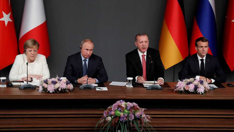 German Chancellor Angela Merkel, Russian President Vladimir Putin, Turkish President Tayyip Erdogan and French President Emmanuel Macron attend a news conference during the Syria summit in Istanbul, Turkey, October 27, 2018.