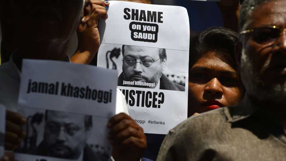 Members of the Sri Lankan web journalist association hold placards with the image of Saudi journalist Jamal Khashoggi during a demonstration outside the Saudi Embassy in Colombo on October 25, 2018, following Khashoggi's dissapearance on October 2 at the Saudi consulate in Istanbul.