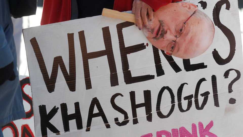 An activist holds a sign and image of missing Saudi journalist Jamal Khashoggi during a demonstration calling for sanctions against Saudi Arabia and to protest Khashoggi's disappearance, outside the White House in Washington, US, October 19, 2018.