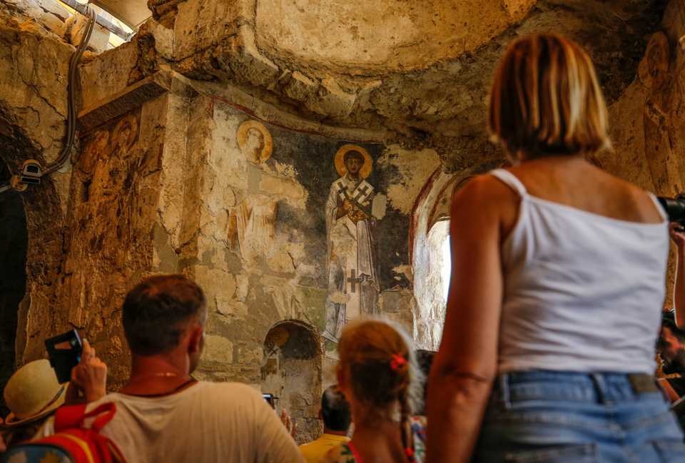 Tourists visit the Byzantine Period's Saint Nicholas Monument Museum, known as Santa Claus who was born in the ancient Lycian city, in Antalya on the Mediterranean coast of Turkey on July 25, 2018.