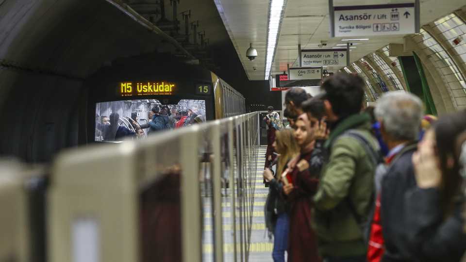 Caption: Passengers wait for a train at subway station on November 14, 2018 in Istanbul, Turkey.