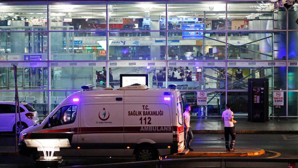 Turkish rescue services gather outside Istanbul's Ataturk airport on June 28, 2016. Two explosions rocked Istanbul's Ataturk airport. A Turkish official said two attackers blew themselves up at the airport after taking on police fire. The official said the attackers detonated the explosives at the entrance of the international terminal before entering the x-ray security check.