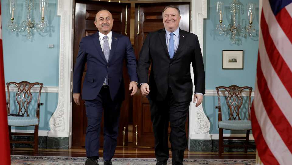 US Secretary of State Mike Pompeo (R) walks with Turkey's Foreign Minister Mevlut Cavusoglu before their meeting at the State Department in Washington, US, November 20, 2018.