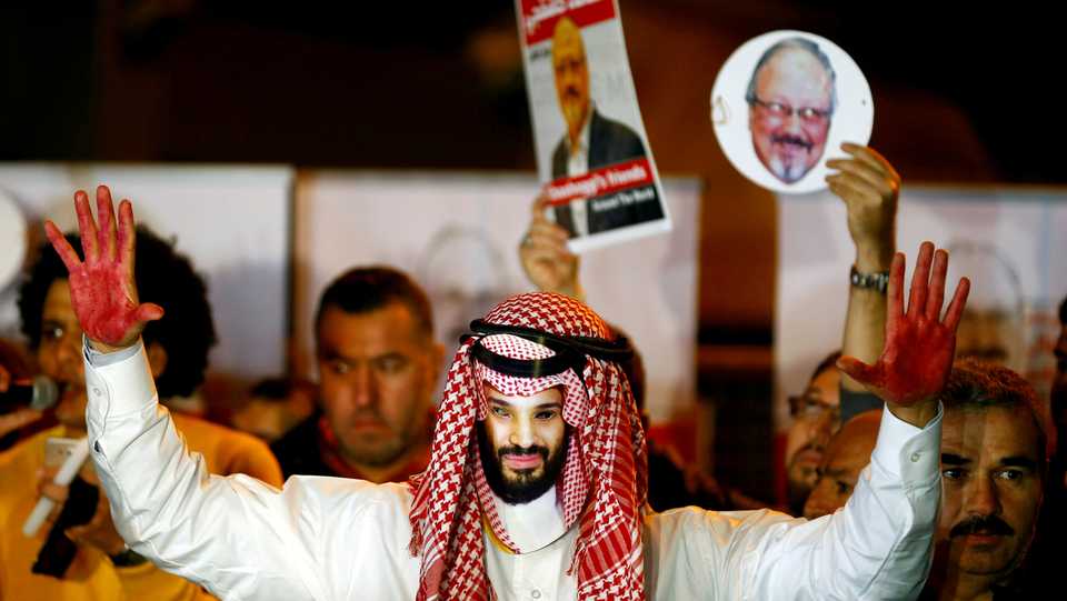 A demonstrator wearing a mask of Saudi Crown Prince Mohammed bin Salman attends a protest outside the Saudi Arabia consulate in Istanbul, Turkey, October 25, 2018.