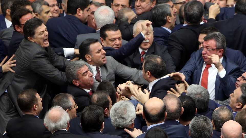 Lawmakers from the ruling AK Party and the main opposition Republican People's Party (CHP) scuffle during a debate on the proposed constitutional changes at the Turkish Parliament in Ankara, Turkey January 11, 2017.