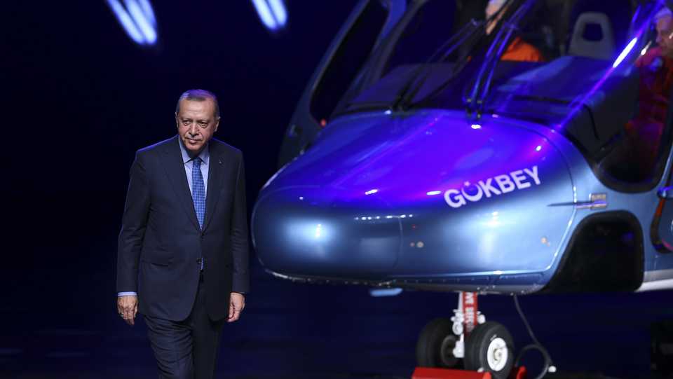 Turkey's President Recep Tayyip Erdogan introduces the country's first indigenous multi-purpose helicopter T625 named as 'Gokbey' during the Turkish Defense Industry Summit at the Bestepe People's Congress and Culture Center of the Presidential Complex in Ankara, Turkey on December 12, 2018.