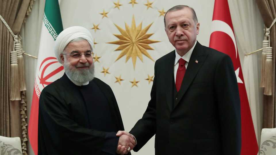 Iranian President Hassan Rouhani (L) and Turkish President Recep Tayyip Erdogan before a meeting at Turkey's Presidential Palace in Ankara on December 20, 2018.