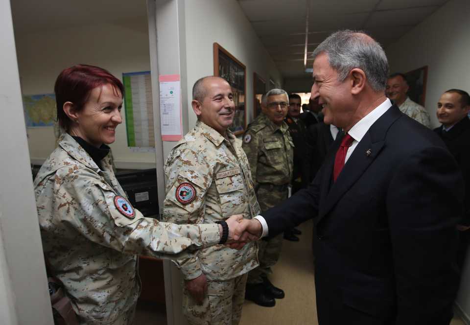 Turkish National Defense Minister Hulusi Akar (R) greets a soldier during his visit to the Turkish Task Force Command in Kabul, Afghanistan on December 22, 2018.