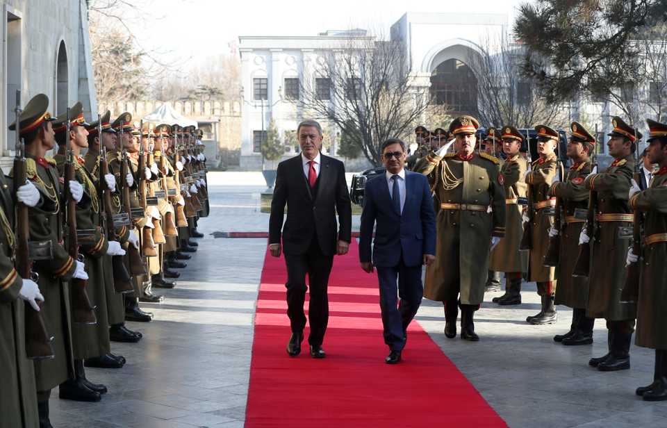 Turkish National Defense Minister Hulusi Akar (C-L) is welcomed with an official ceremony by Defence Minister of Afghanistan, Tariq Shah Bahrami (C-R) in Kabul, Afghanistan on December 21, 2018.