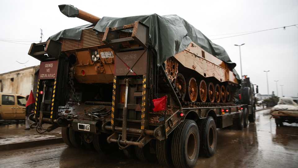 This picture taken on December 26, 2018 shows a Turkish tank being transported into the rebel-held town of al Rai in northern Syria.