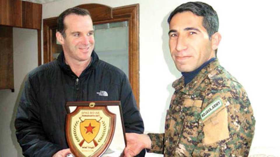 Brett McGurk, the former US-led anti-Daesh coalition coordinator, is pictured with one of the YPG commanders in Kobani, a YPG-held area in northern Syria.