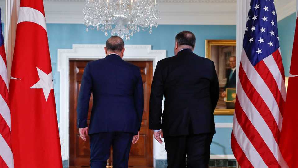Secretary of State Mike Pompeo, right, and Turkish Foreign Minister Mevlut Cavusoglu, left, walk back after meeting members of the media at the State Department in Washington, Tuesday, Nov. 20, 2018.