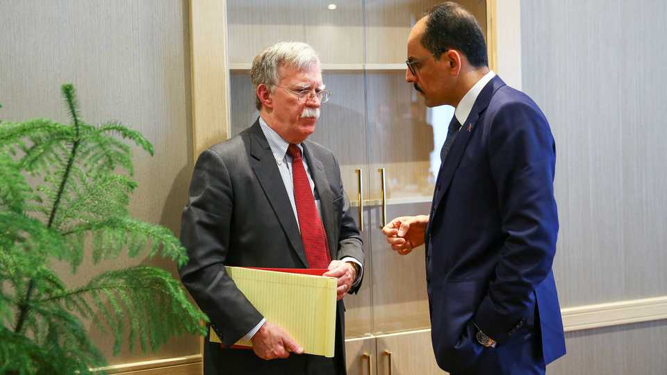 In this file photo, US National Security Advisor John Bolton (L) and his Turkish counterpart Ibrahim Kalin meet at the Presidential Palace in Ankara, Turkey, January 8, 2019.