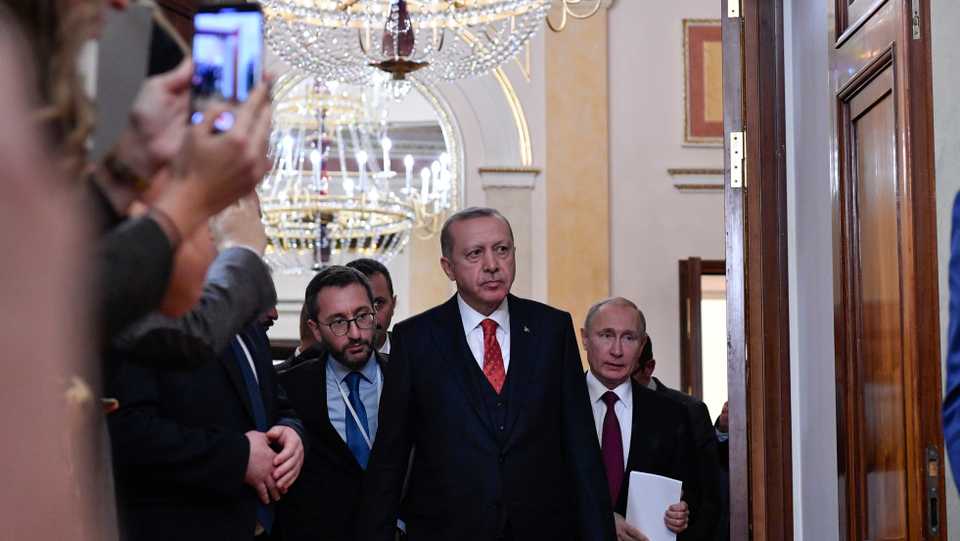 Russian President Vladimir Putin and his Turkish counterpart Recep Tayyip Erdogan enter a hall prior to a joint press conference following their meeting at the Kremlin in Moscow on January 23, 2019.