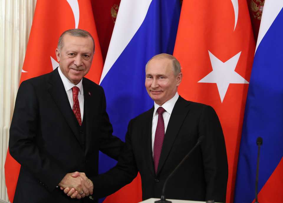 Russian President Vladimir Putin (R) and Turkish President Recep Tayyip Erdogan (L) shake hands at the end of a joint press conference following their meeting at the Kremlin in Moscow on January 23, 2019.