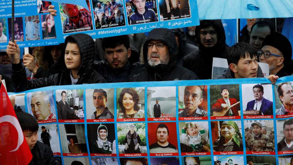Ethnic Uighur demonstrators hold portraits of their relatives reportedly missing, during a demonstration against China in Istanbul, Turkey, February 23, 2019.