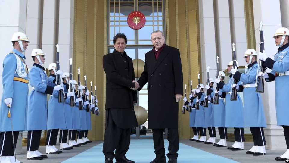Turkey's President Recep Tayyip Erdogan, right, welcomes Pakistan's Prime Minister Imran Khan to Ankara, Turkey, Friday, January 4, 2019.