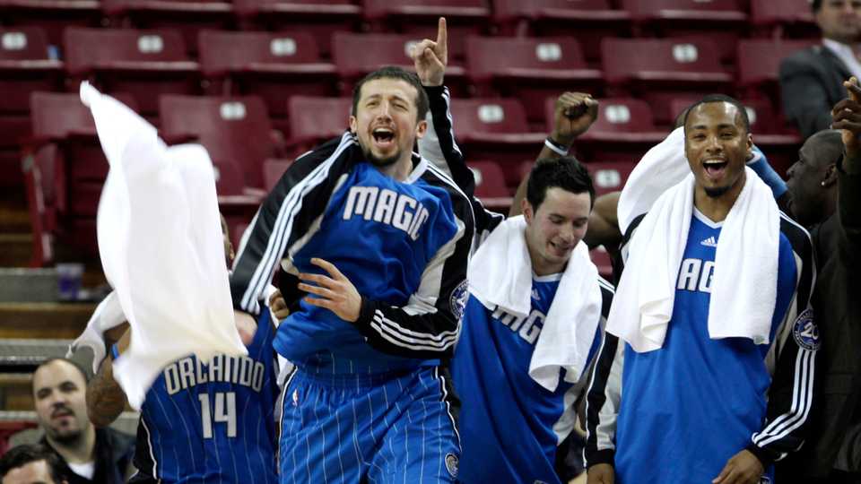 Orlando Magic Hedo Turkoglu, of Turkey, second from left, J.J. Redick, second from right, and Rashard Lewis, right, celebrate after the Magic broke the NBA record for 3-point shots made in a game during the fourth quarter in an NBA basketball game against the Sacramento Kings in Sacramento, Calif., Tuesday, Jan. 13, 2009.
