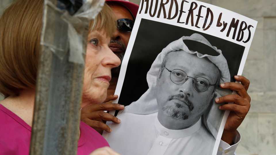 A protester outside the Embassy of Saudi Arabia in Washington, US holds a picture of missing journalist Jamal Khashoggi. October 10, 2018.
